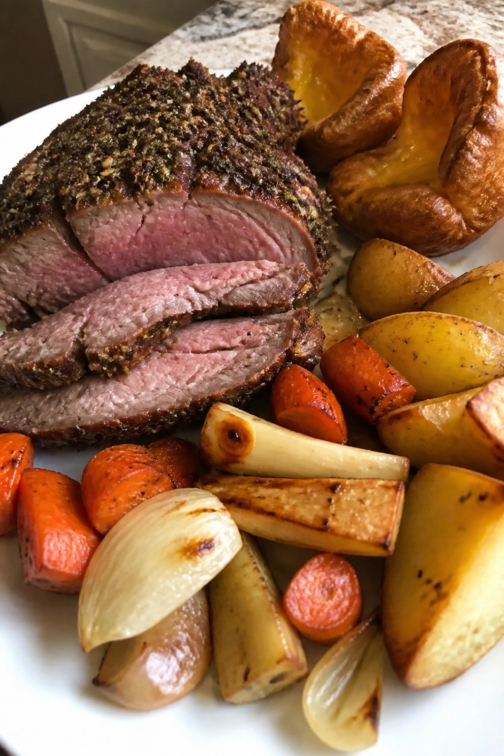 Herb-Crusted Prime Rib Roast with Yorkshire Pudding and Roasted Root Vegetables