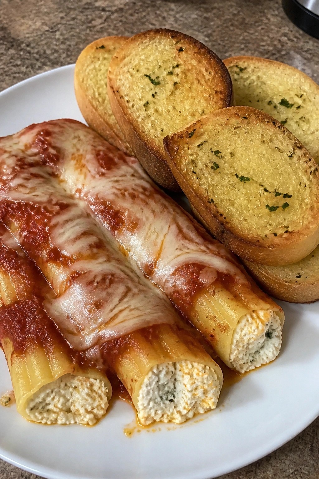 Baked Three-Cheese Manicotti with Garlic Bread