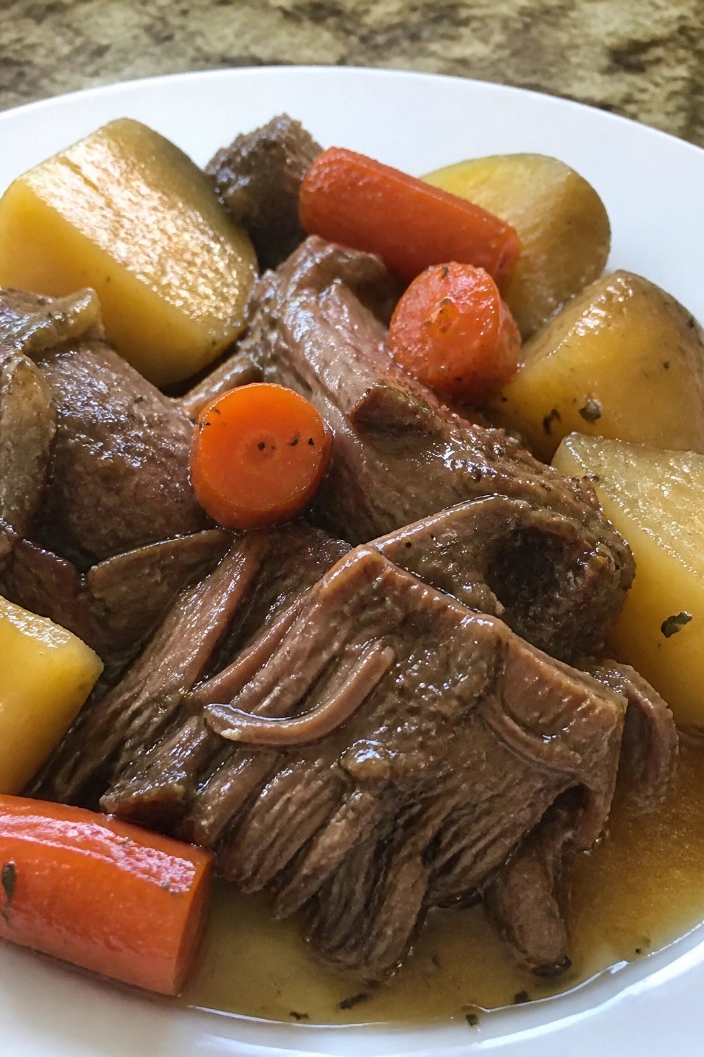Slow-Simmered Beef Pot Roast with Carrots, Potatoes, and Gravy