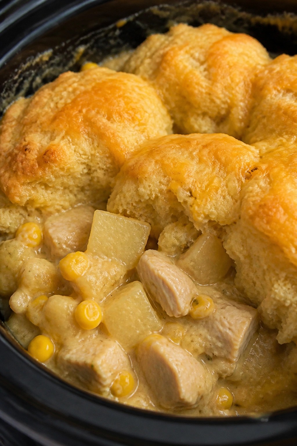 Cheesy Crockpot Chicken Pot Pie with Corn, Potatoes, and Cheddar Biscuit Topping