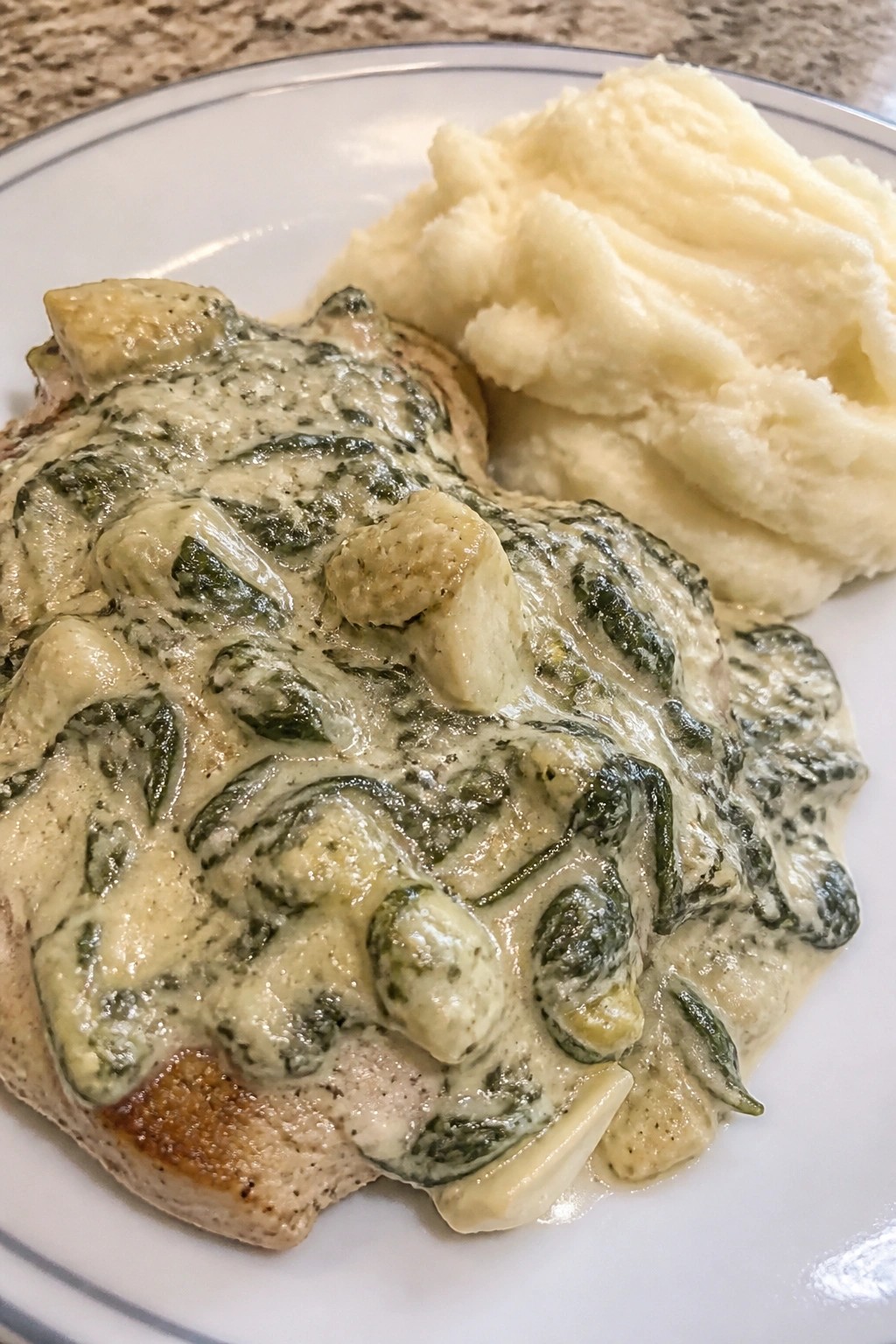 Spinach Artichoke Pork Chops with Mashed Potatoes