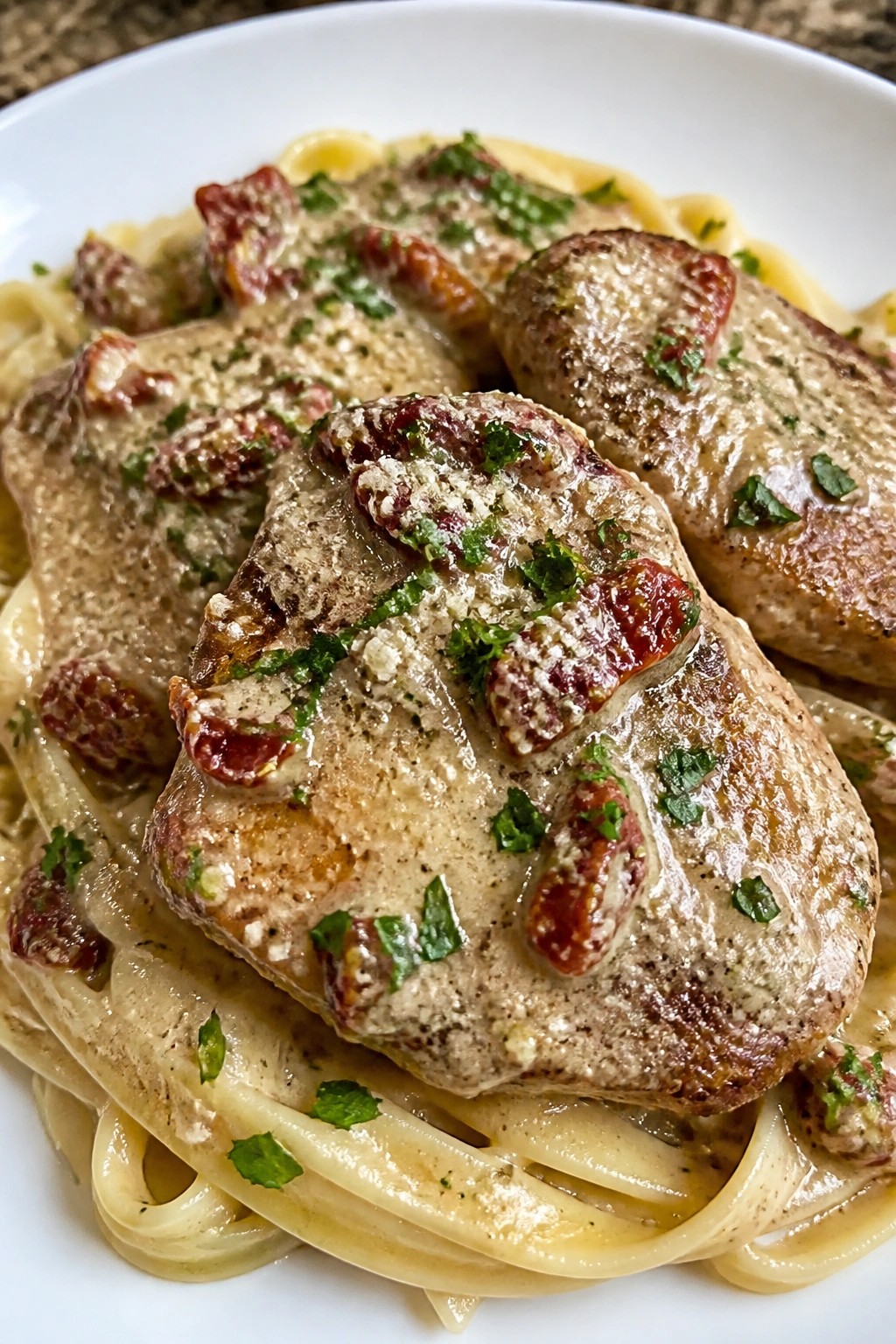 Sun-Dried Tomato Alfredo Pork Chops with Fettuccine
