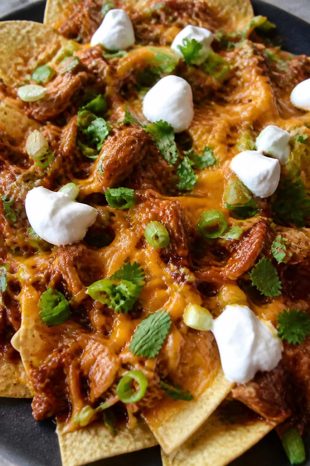 Spicy Chipotle BBQ Chicken Nachos with Melted Cheese
