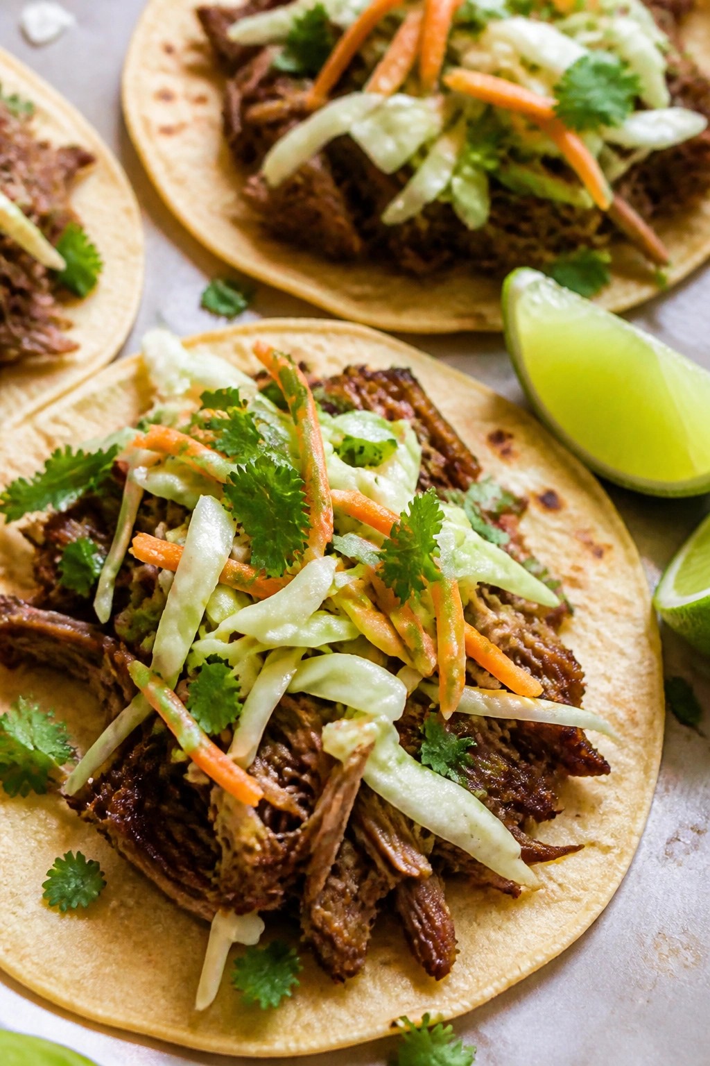Slow Cooker Pulled Pork Tacos with Cabbage Slaw