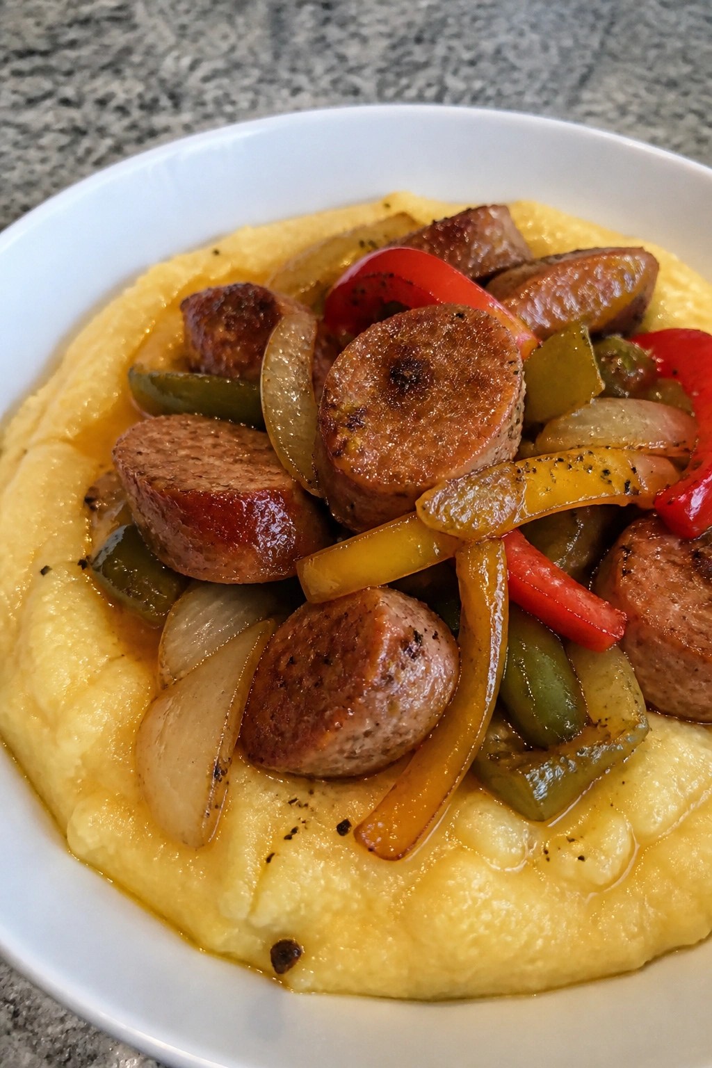 Slow Cooker Sausage, Peppers, and Onions over Polenta
