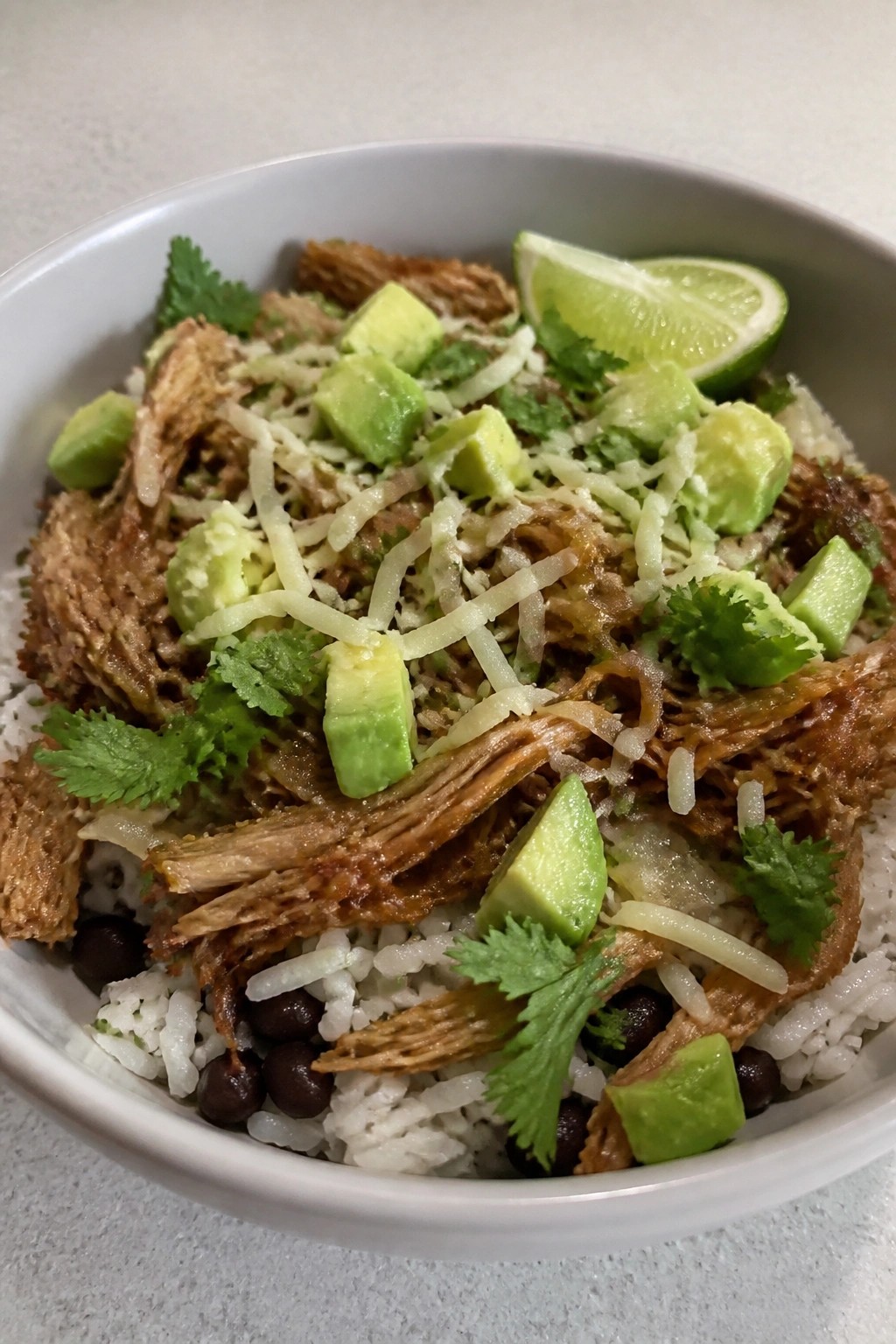 Slow Cooker Pork Carnitas Burrito Bowls with Rice and Beans