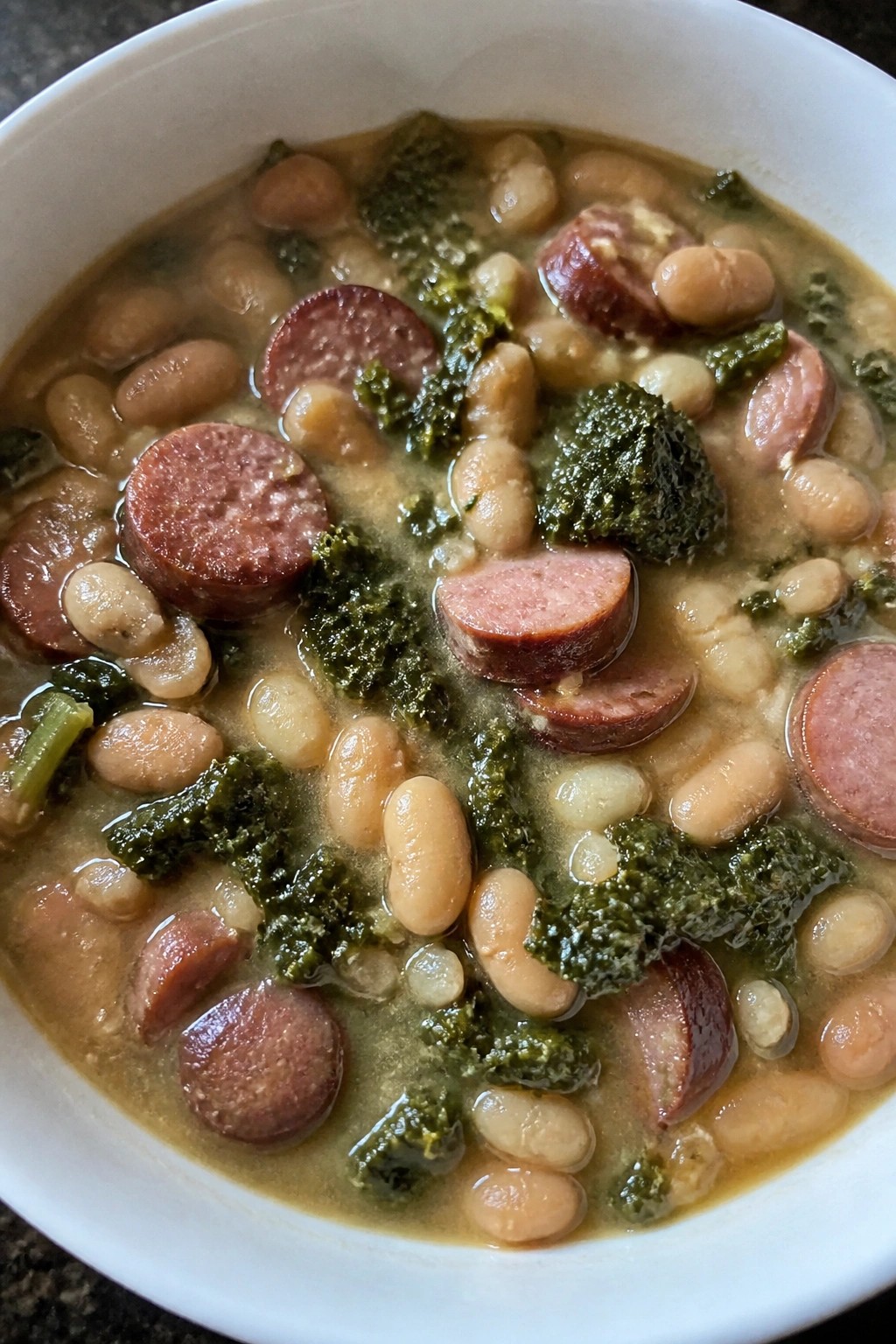 Slow Cooker Sausage, Bean, and Greens Cassoulet-Style