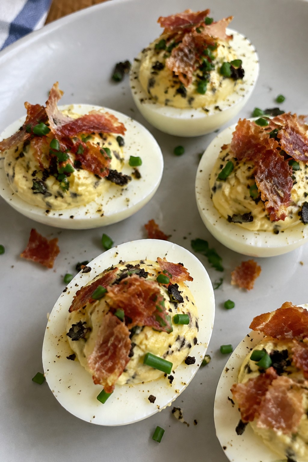 Black Truffle Deviled Eggs with Crispy Prosciutto