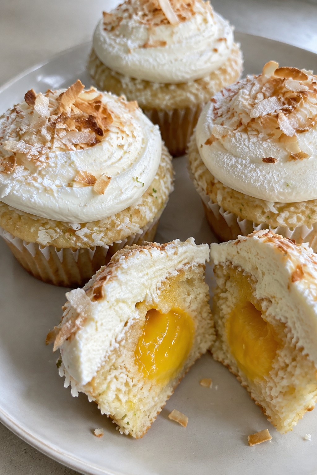 Coconut Lime Cupcakes with Mango Curd Filling