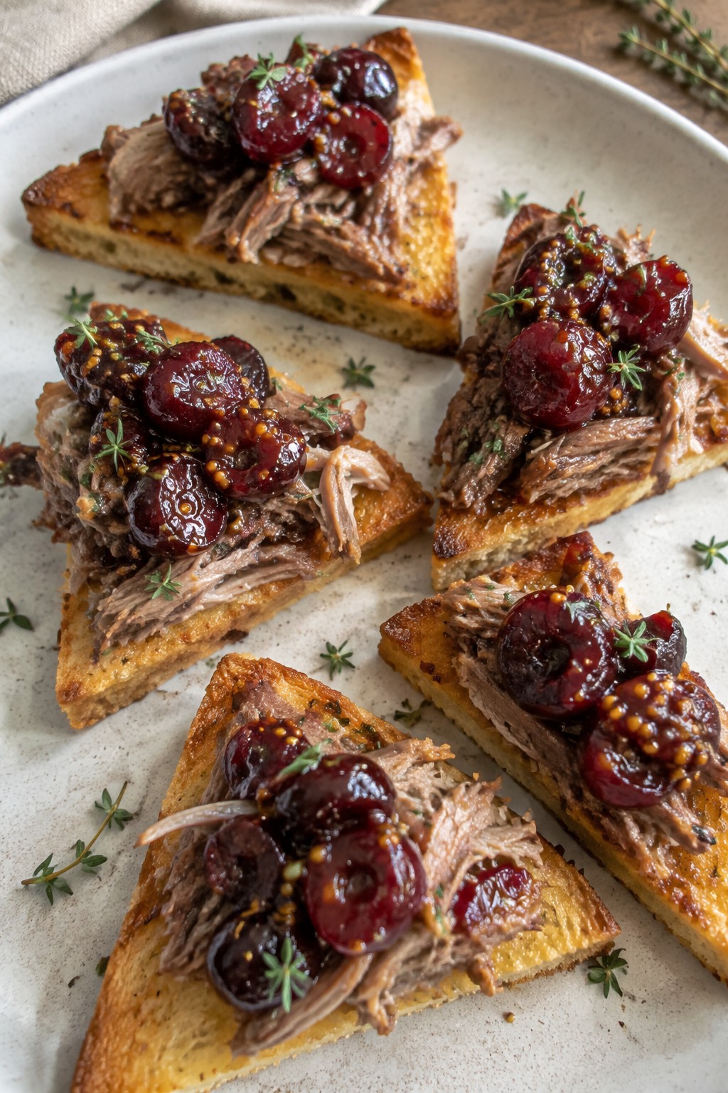 Duck Confit and Cherry Mostarda on Toasted Brioche Points