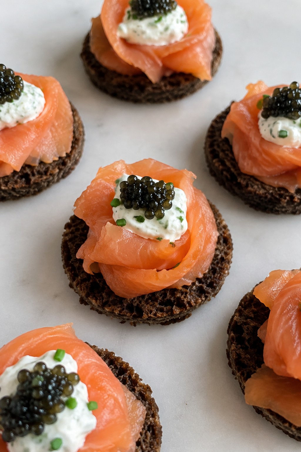 Smoked Salmon Rosettes on Pumpernickel with Caviar and Chive Crème