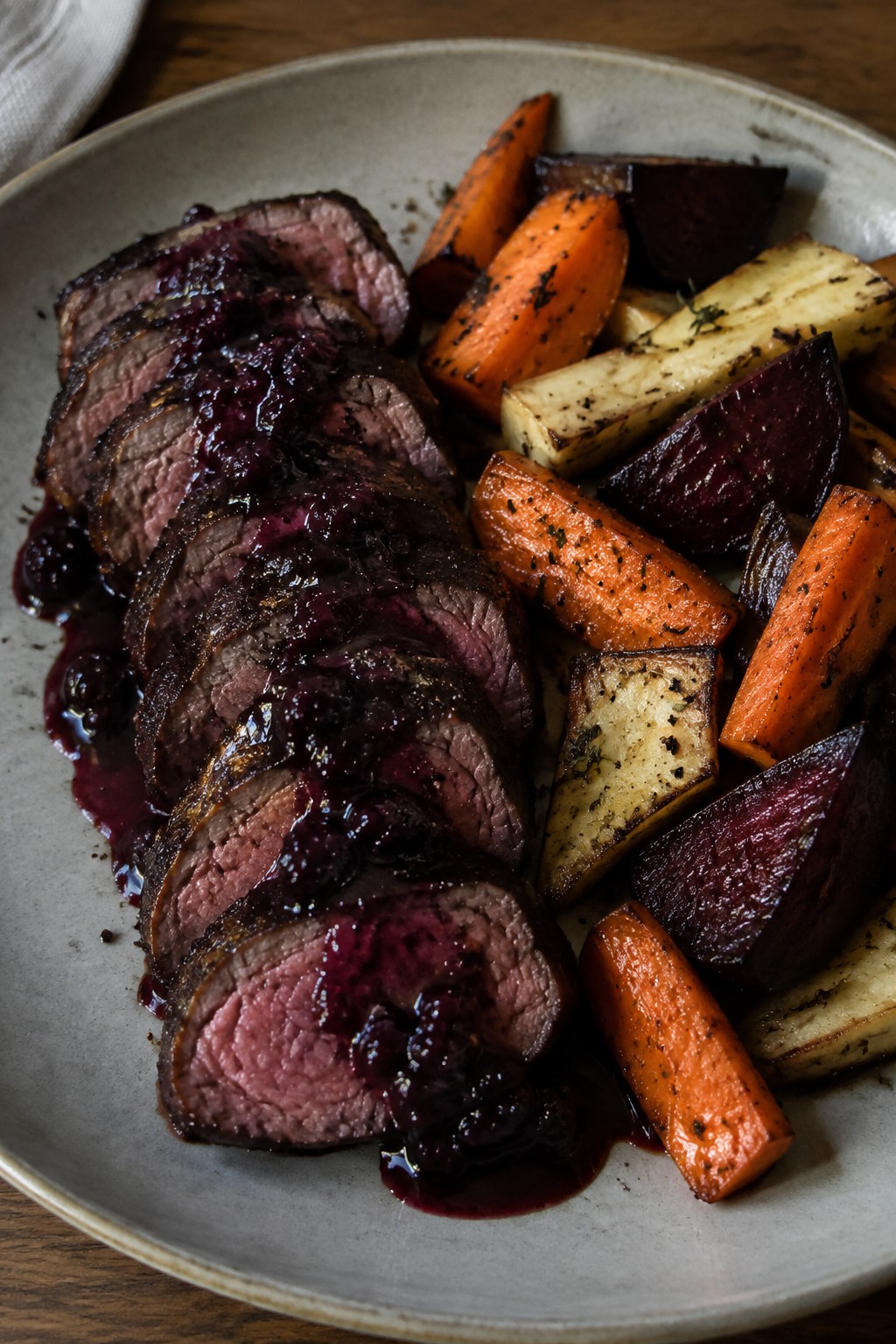 Venison Tenderloin with Blackberry Reduction and Roasted Roots