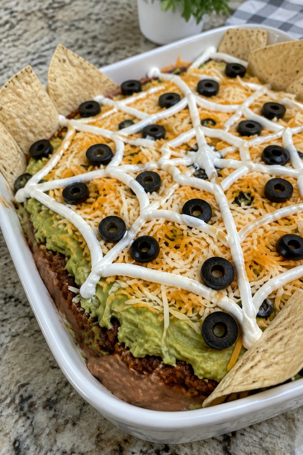 Spiderweb Layered Taco Dip with Tortilla Chips
