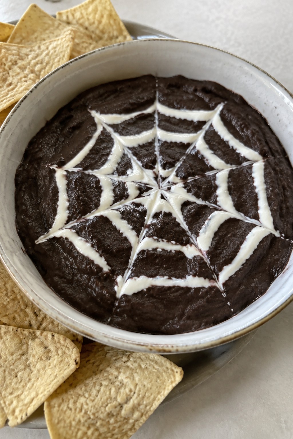 Spiderweb Black Bean Dip with Tortilla Chips