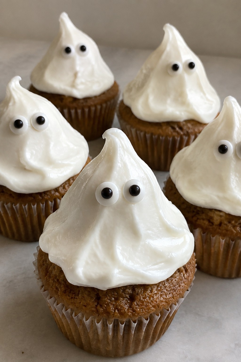Pumpkin Spice Ghost Cupcakes with Cream Cheese Frosting