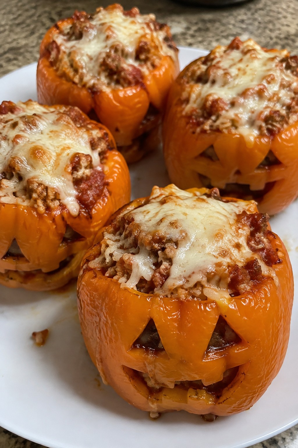 Jack-O'-Lantern Stuffed Bell Peppers with Ground Turkey and Rice
