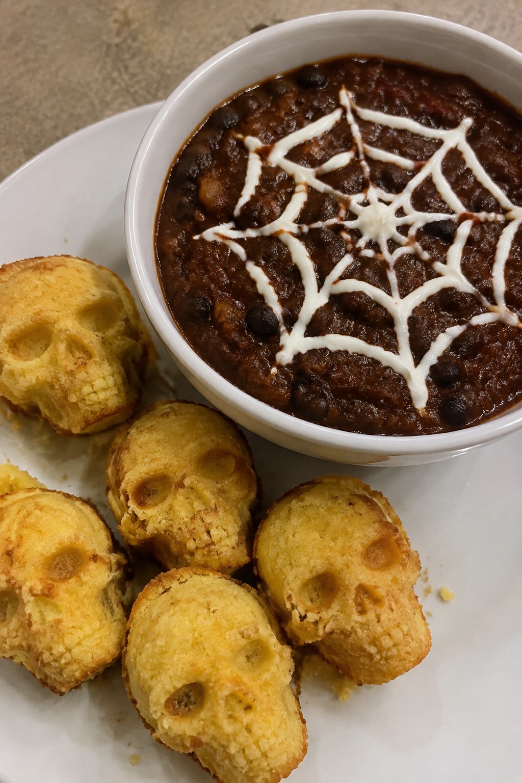 Spiderweb Black Bean Chili with Cornbread Skulls