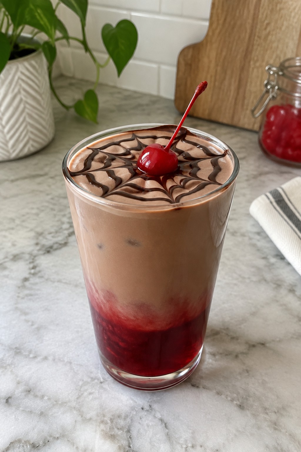 Spiderweb Layered Chocolate Cherry Drink