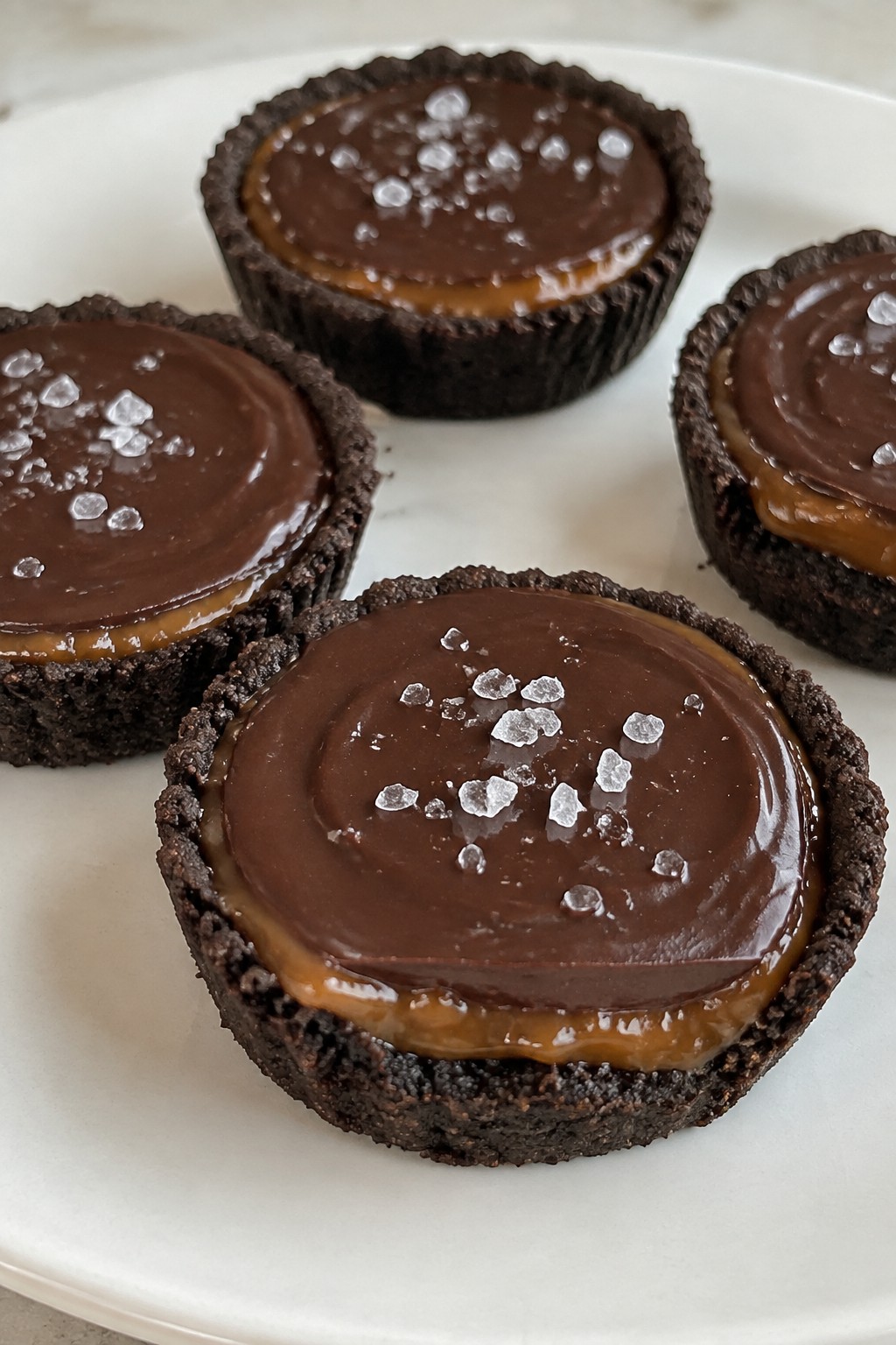 Salted Caramel Dark Chocolate Tartlets with Smoked Sea Salt