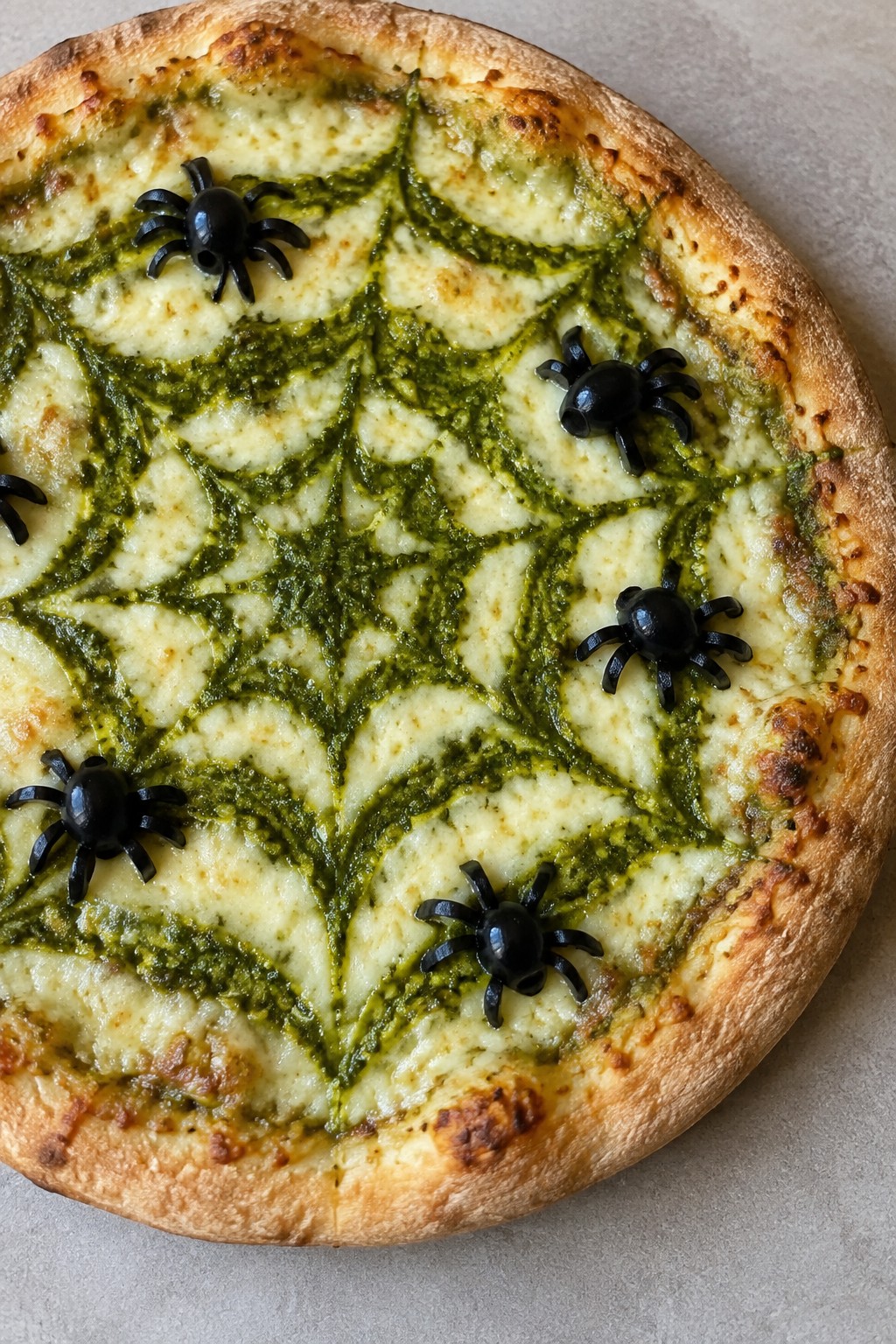 Spiderweb Black Olive and Pesto Pizza
