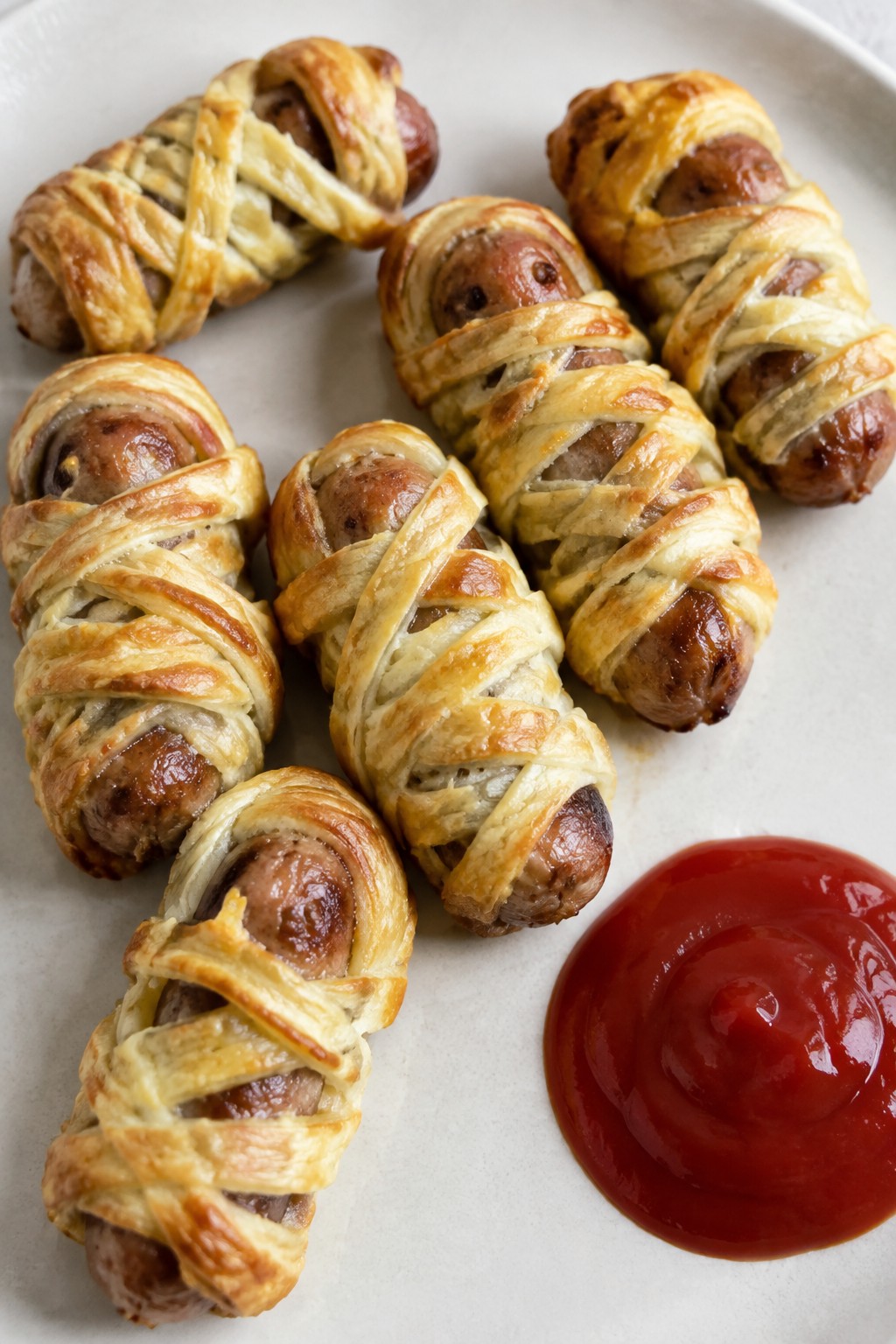 Mummy-Wrapped Sausage Rolls with Ketchup Blood