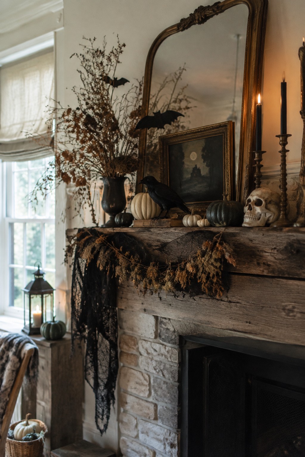 Rustic wooden mantel decorated with black bats, a crow, a skull, pumpkins, and black candles.