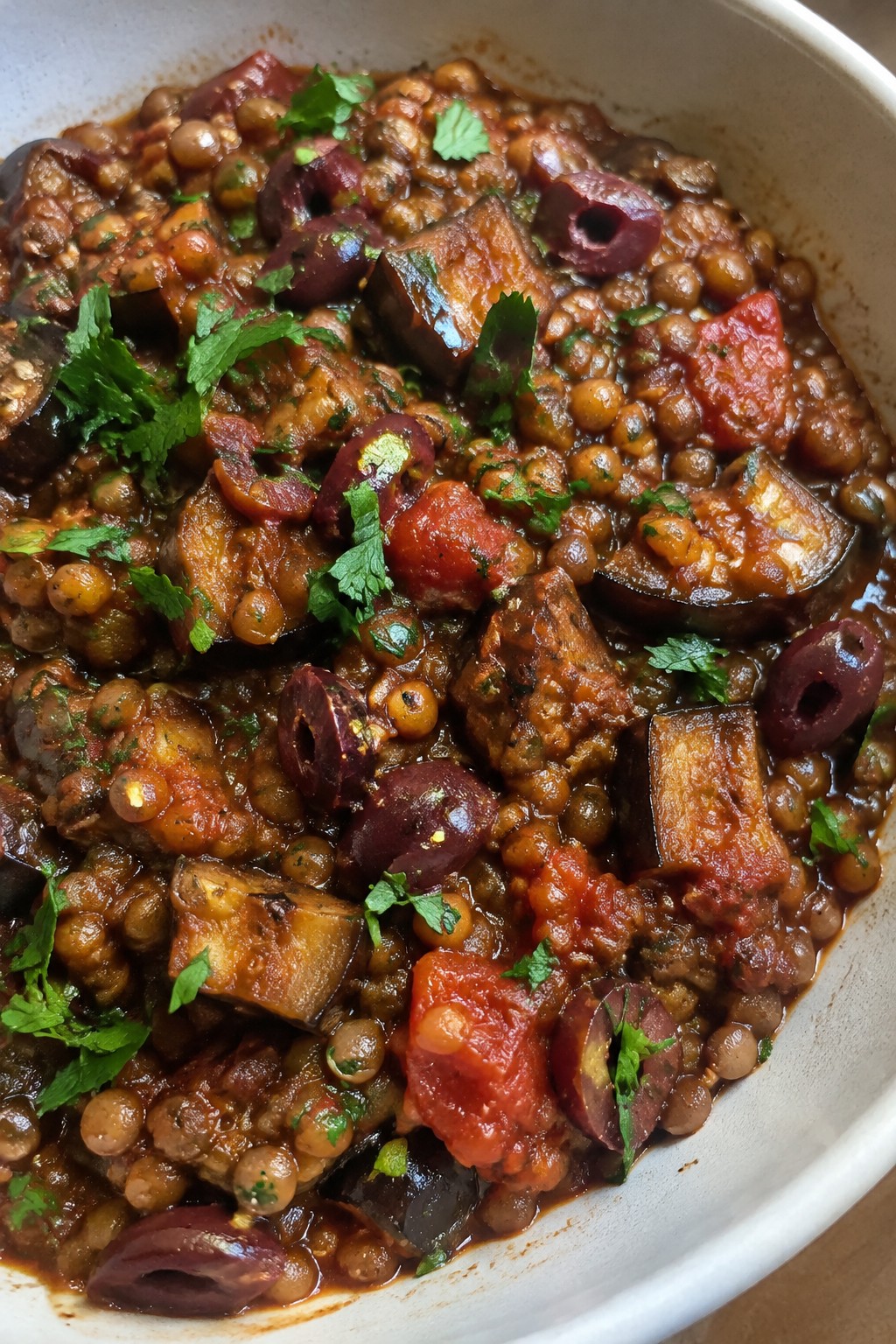 Harissa-Spiced Lentil Stew with Roasted Eggplant and Olives