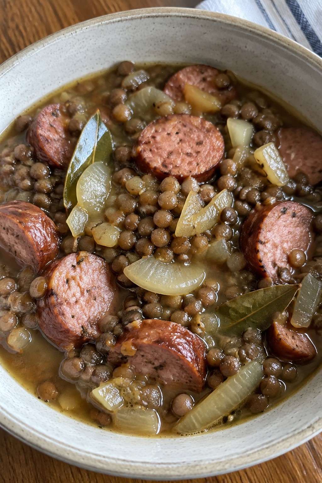 Beer-Braised Kielbasa Lentil Stew with Onions and Bay Leaves
