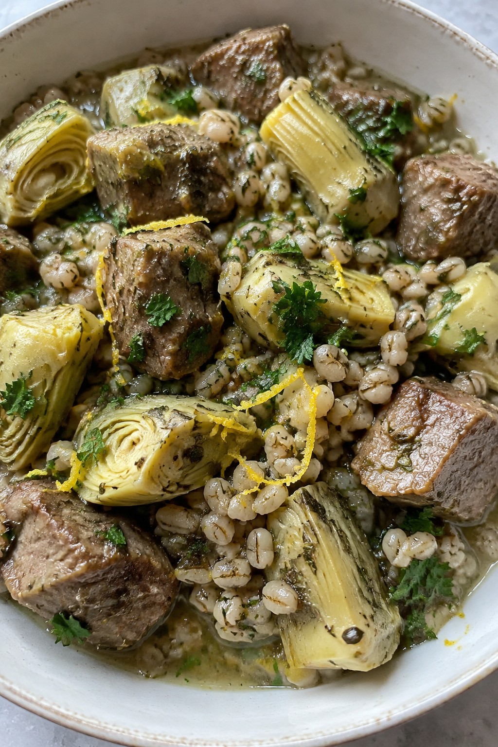 Lemon Herb Greek Lamb Stew with Barley and Artichokes